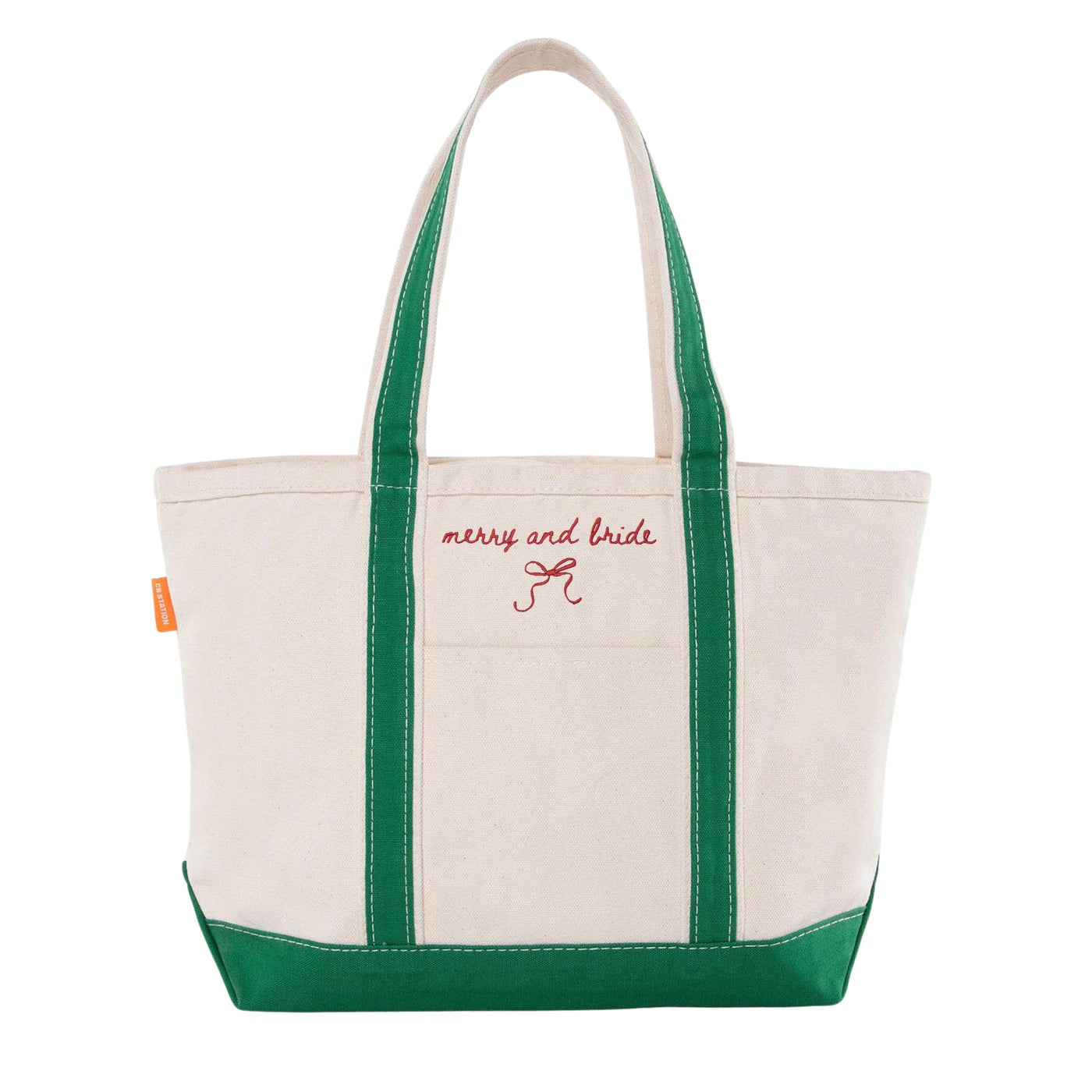 An off-white canvas tote bag with forest green handles and base features a decorative red embroidered design, perfect for a wedding or bridal shower.