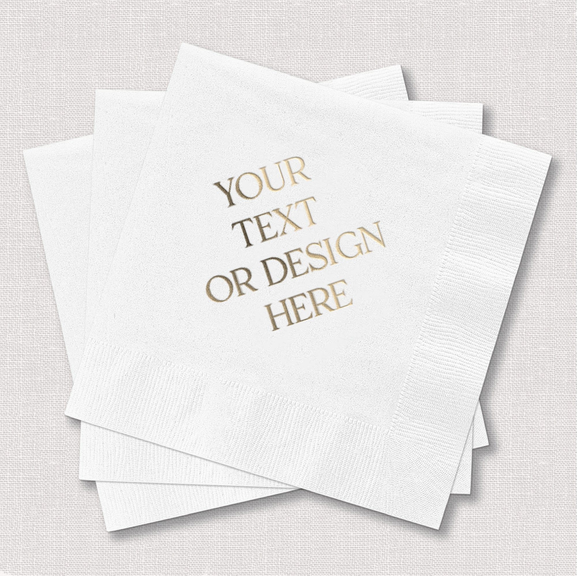 A stack of three white disposable paper napkins, featuring a customizable gold foil design, ideal for a wedding or special event.