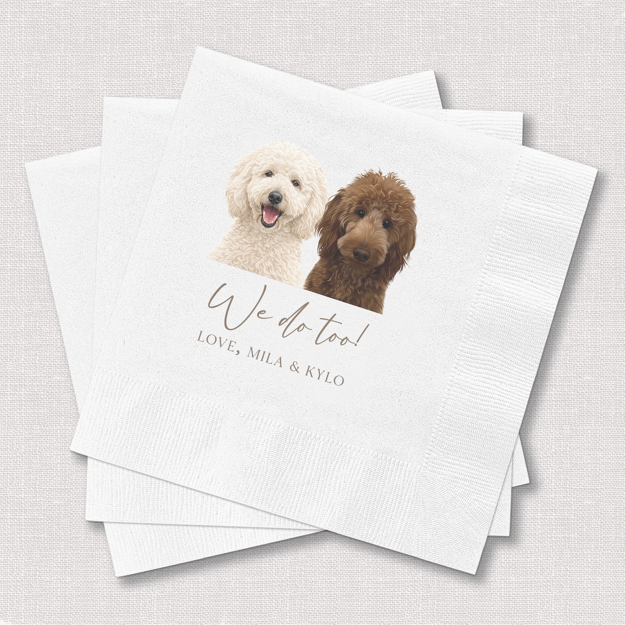 A stack of white textured paper wedding napkins personalized with an illustration of a cream-colored and a brown fluffy dog, ideal for a reception or celebratory event.