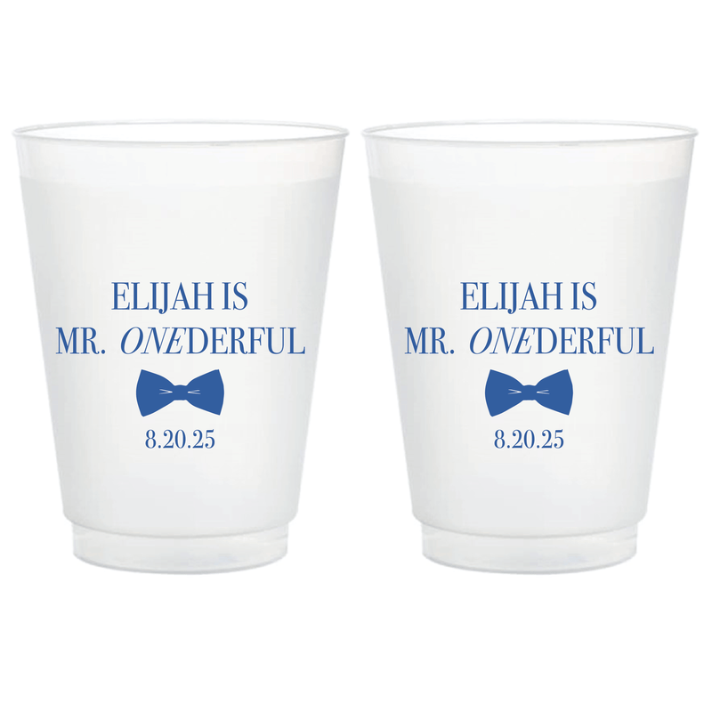 Pair of frosted plastic cups with blue text reading "ELIJAH IS MR. ONEDERFUL" and date "8.20.25" with blue one balloon graphic