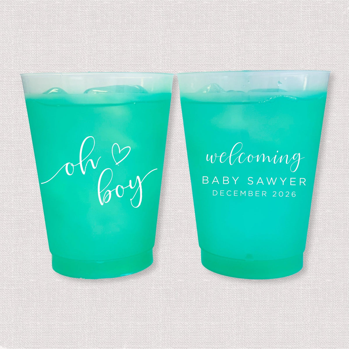 Teal color changing frosted baby shower cups with oh boy script and welcoming Baby Sawyer personalization