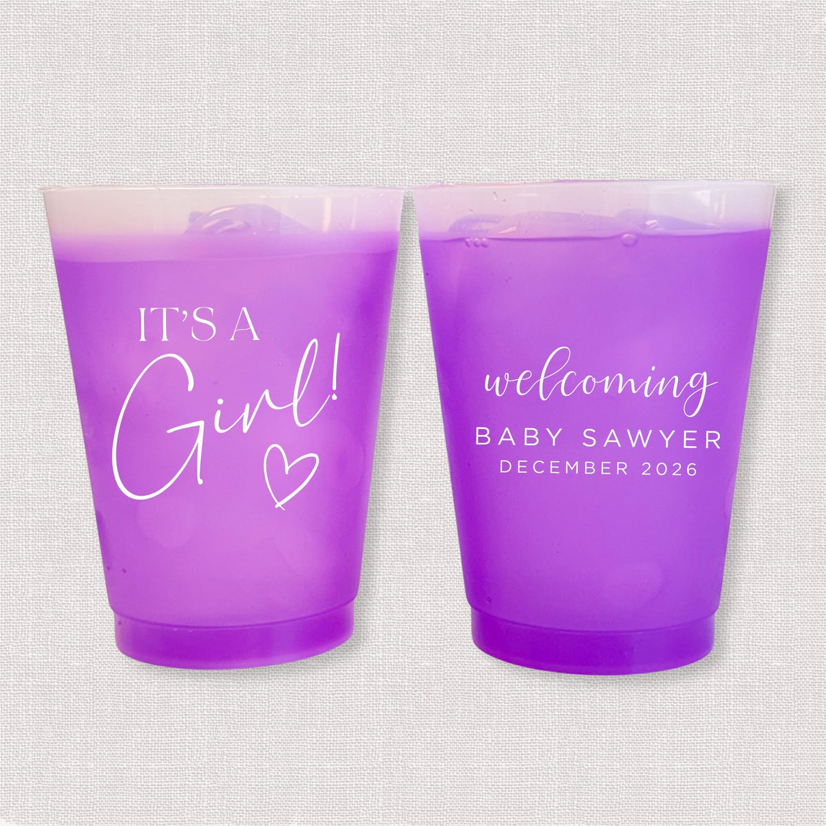 Purple color changing frosted baby shower cups with It's a Girl script and welcoming Baby Sawyer personalization