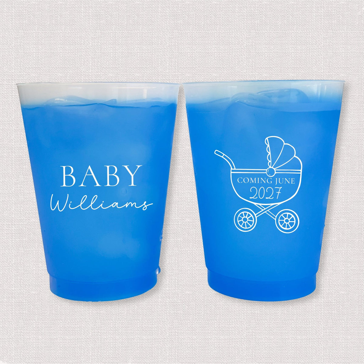 Blue color changing frosted baby shower cups with Baby Williams script and baby carriage due date design