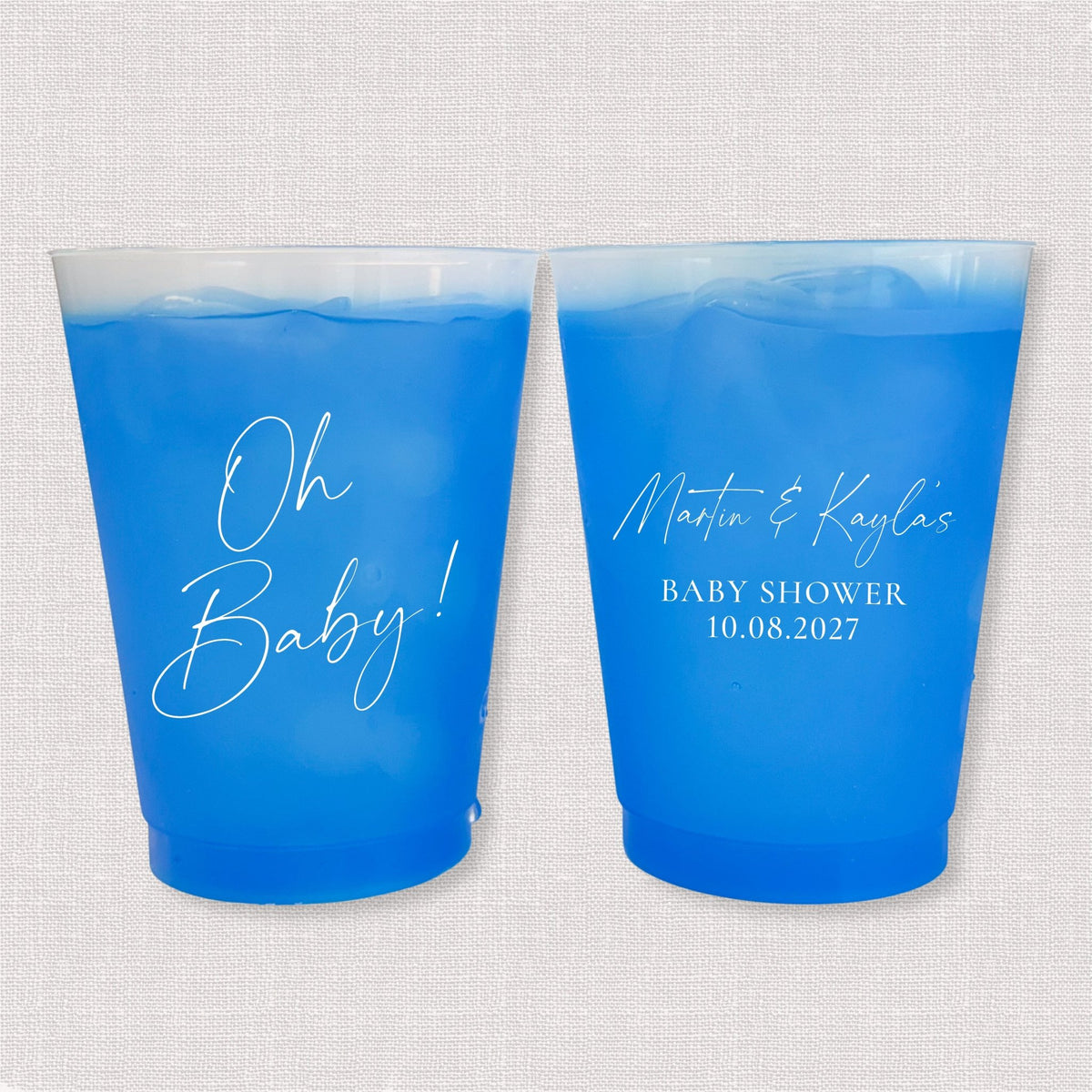 Blue color changing frosted baby shower cups with Oh Baby script and parents' names with shower date