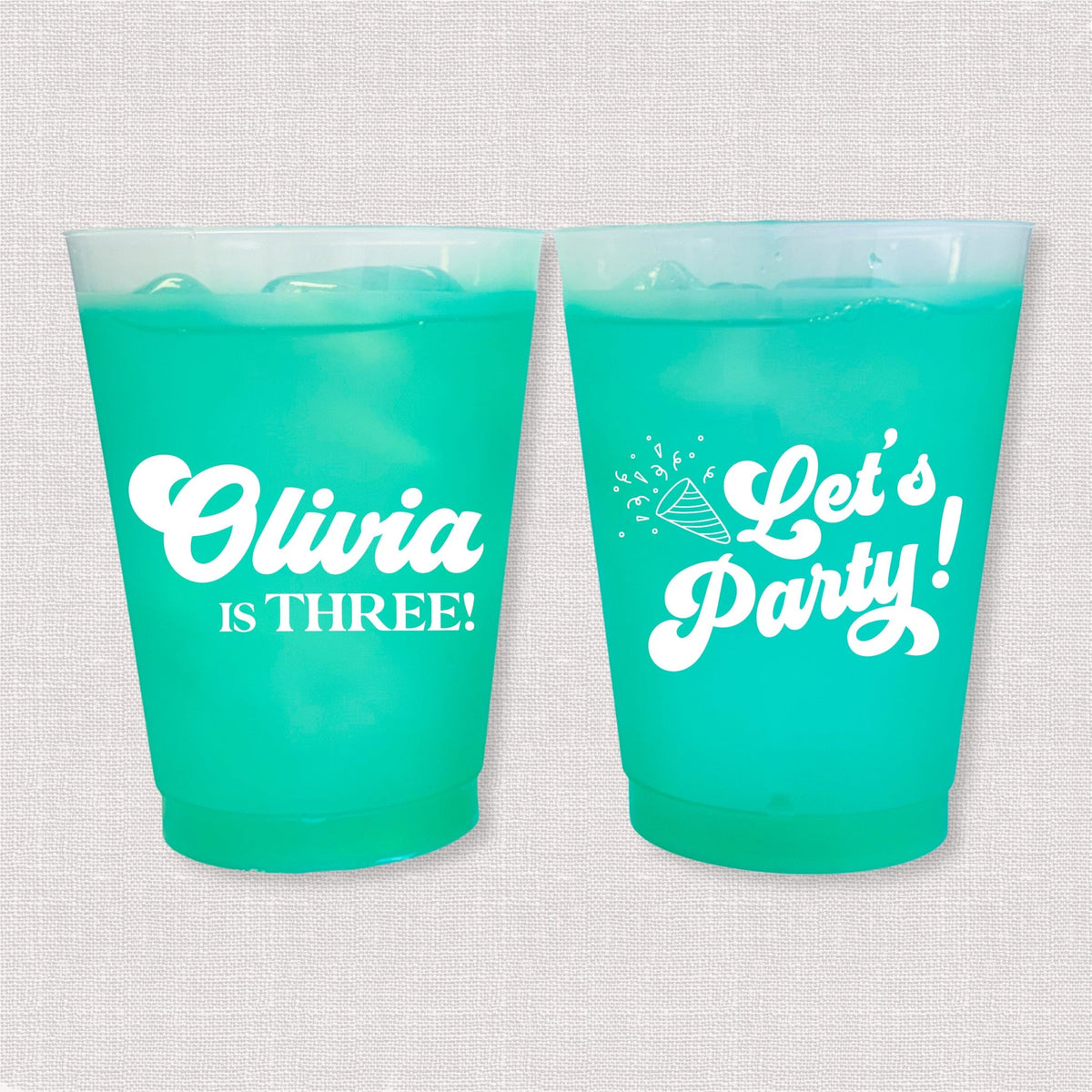 Teal color changing frosted kids birthday cups with Olivia is Three name and Let's Party design