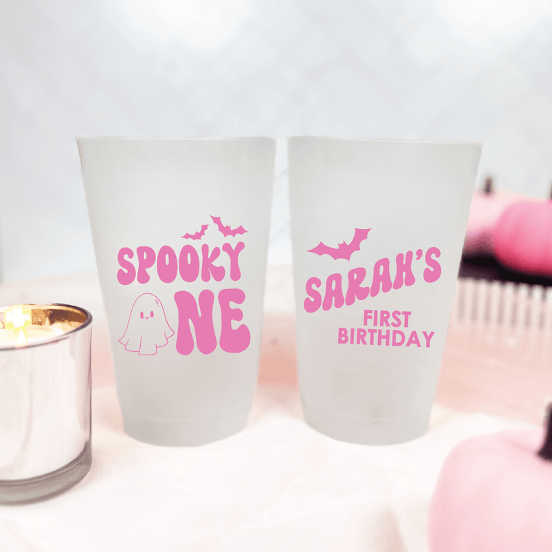 Frosted shatterproof cups with pink "Spooky One" ghost and bat design on front, "Sarah's First Birthday" text on back