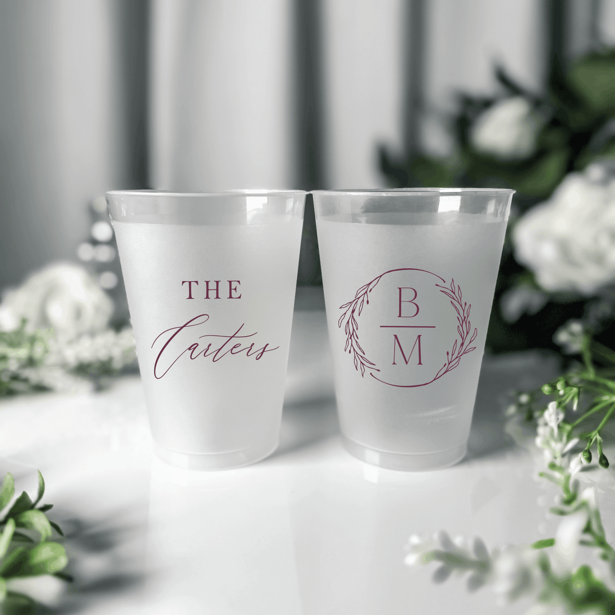 Dusty rose ink frosted shatterproof wedding cups with The Carters script surname and B M wreath monogram