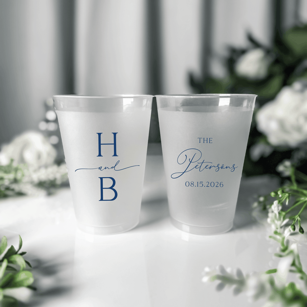 Navy ink frosted shatterproof wedding cups with stacked H and B initials and The Petersons wedding date