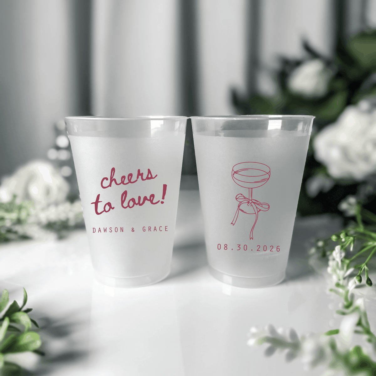Raspberry ink frosted shatterproof wedding cups with cheers to love script, champagne coupe and wedding date