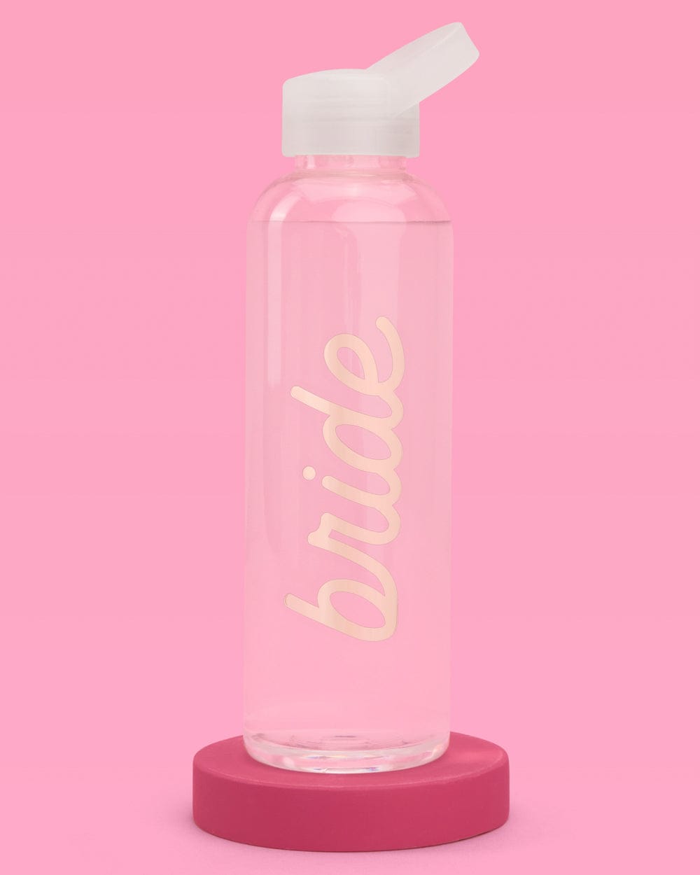 Pink water bottle with "bride" text in cream lettering, white flip-top cap, and burgundy base on pink background.