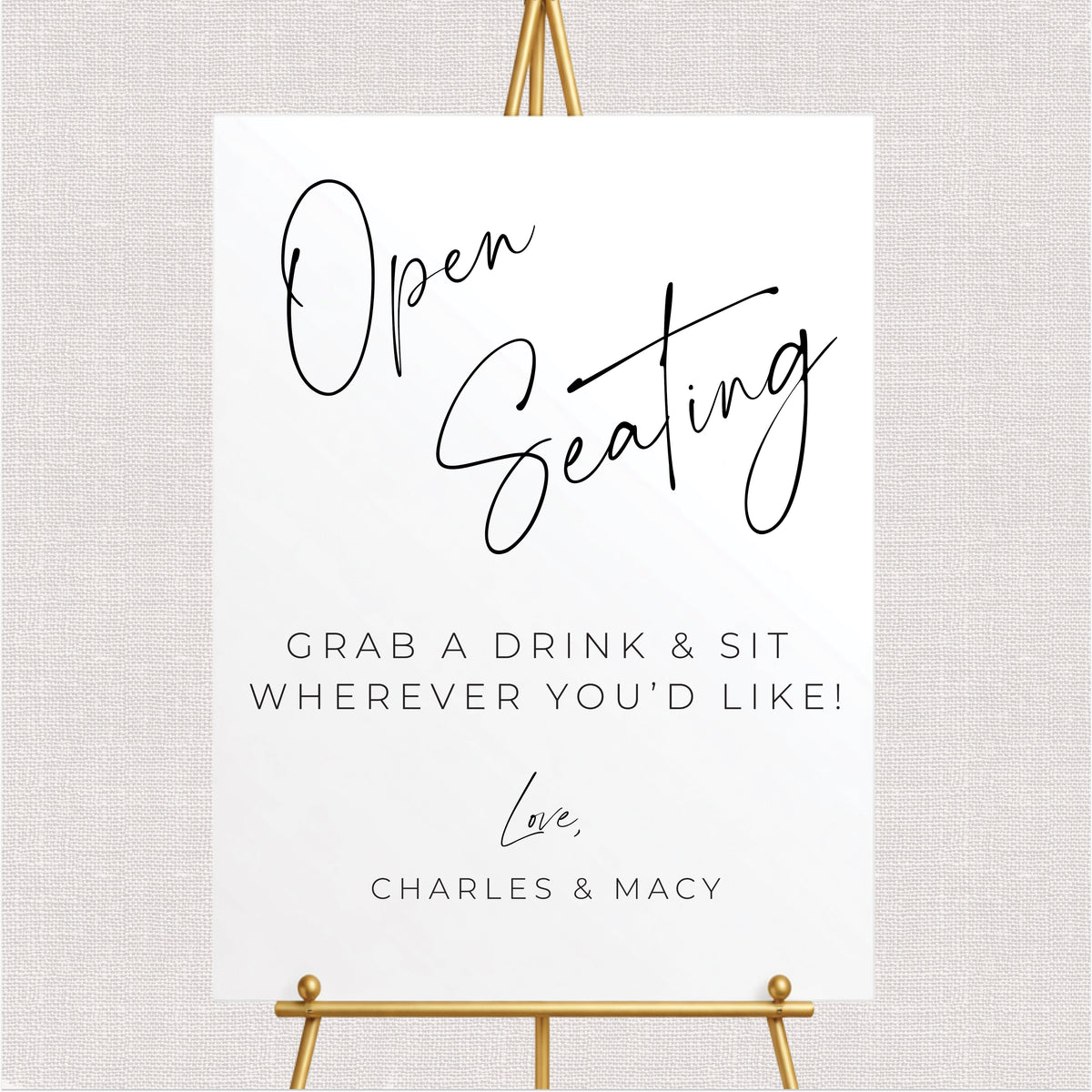 Personalized rectangular open seating wedding sign featuring black lettering, grab a drink and sit wherever you'd like wording, and couple's names.