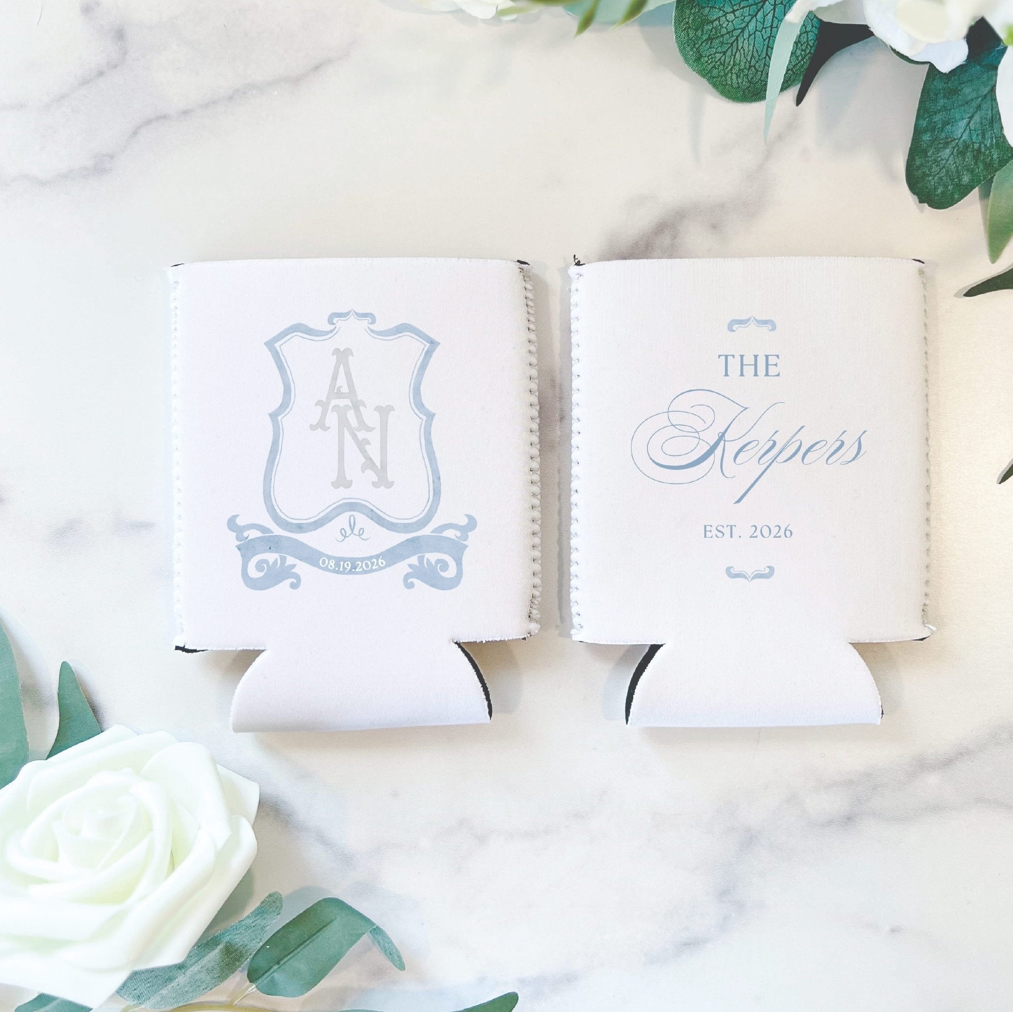 White can coolers with personalized monogram crest and "The Hoppers Est 2026" text in blue