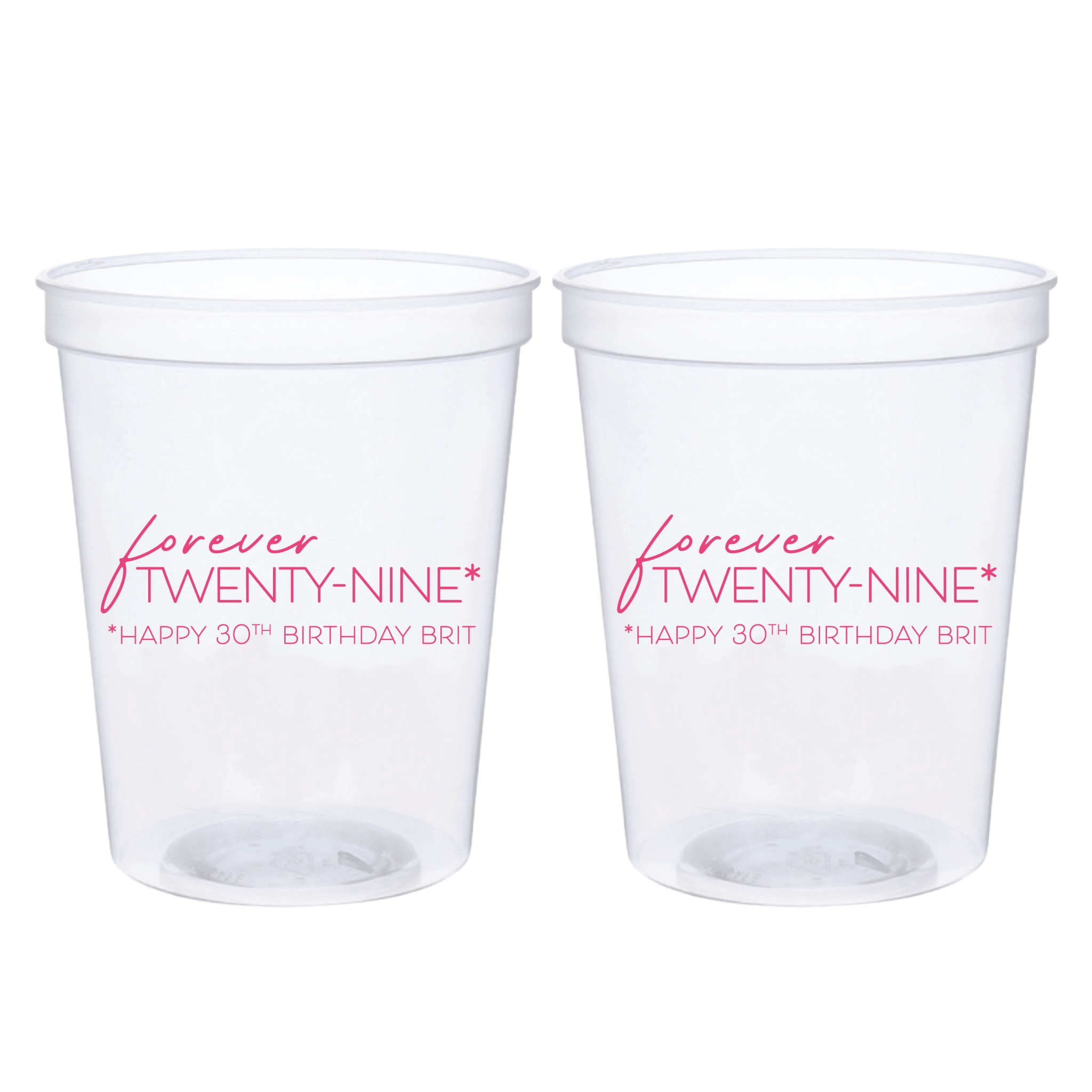 Two clear plastic stadium cups with pink text reading "Forever Twenty-Nine" and "Happy 30th Birthday Brit"