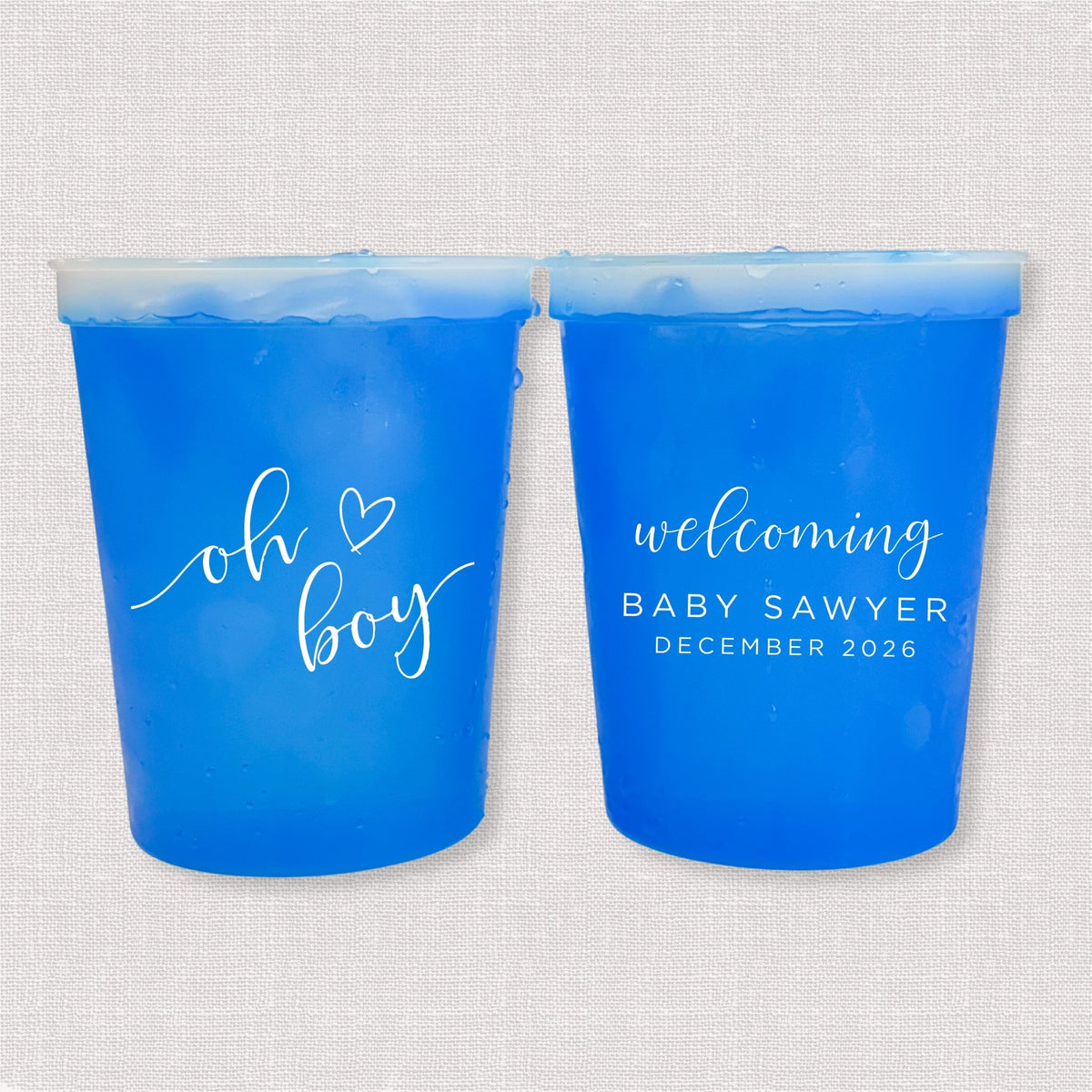 Blue color changing baby shower stadium cups with oh boy script and welcoming Baby Sawyer personalization