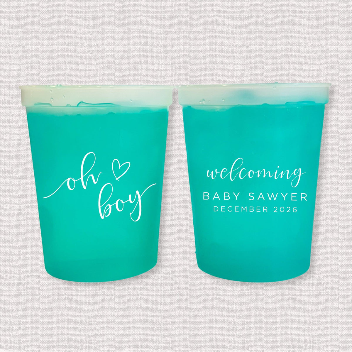 Teal color changing baby shower stadium cups with oh boy script and welcoming Baby Sawyer personalization