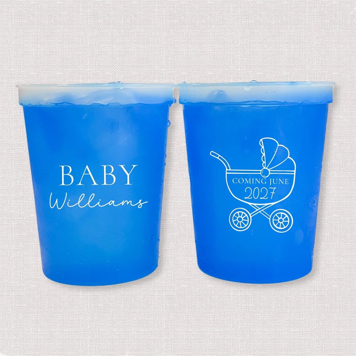Blue color changing baby shower stadium cups with Baby Williams script and baby carriage due date design