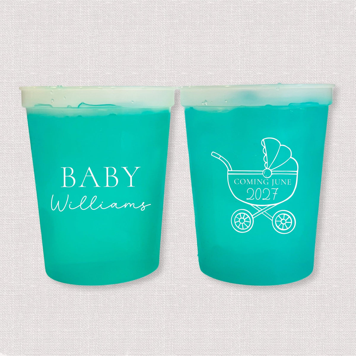 Teal color changing baby shower stadium cups with Baby Williams script and baby carriage due date design
