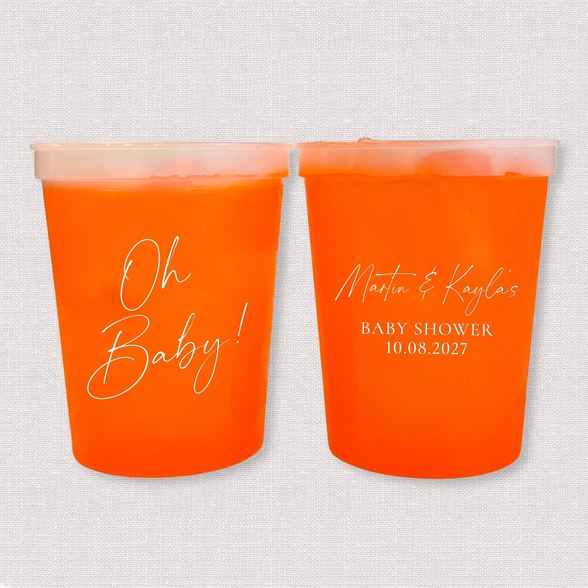 Orange color changing baby shower stadium cups with Oh Baby script and parents' names with shower date