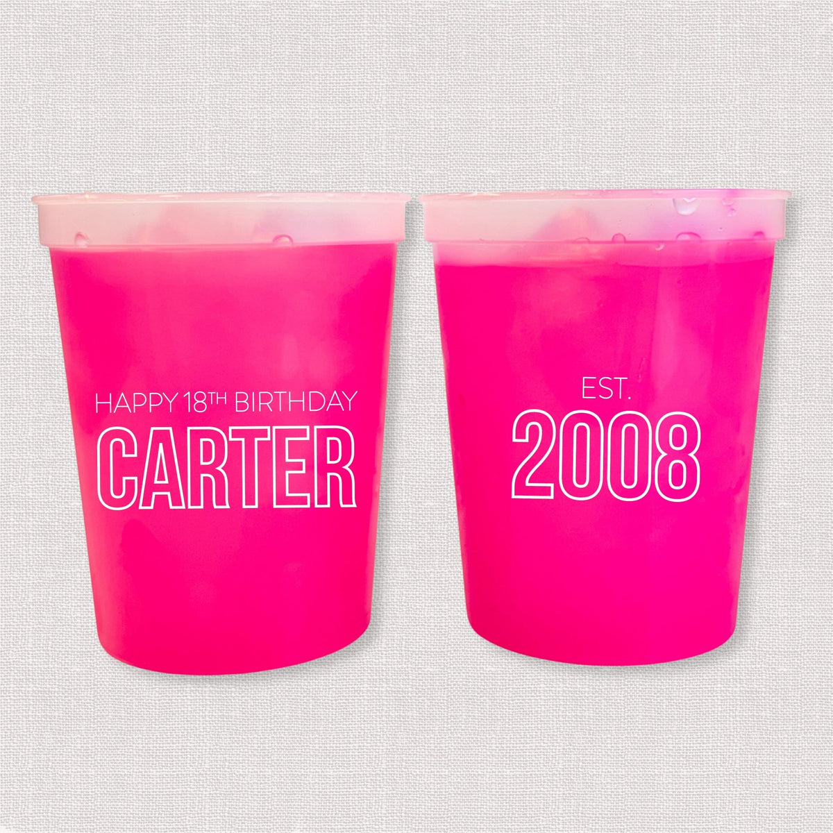 Magenta color changing birthday stadium cups with Happy 18th Birthday Carter and Est. 2008 design