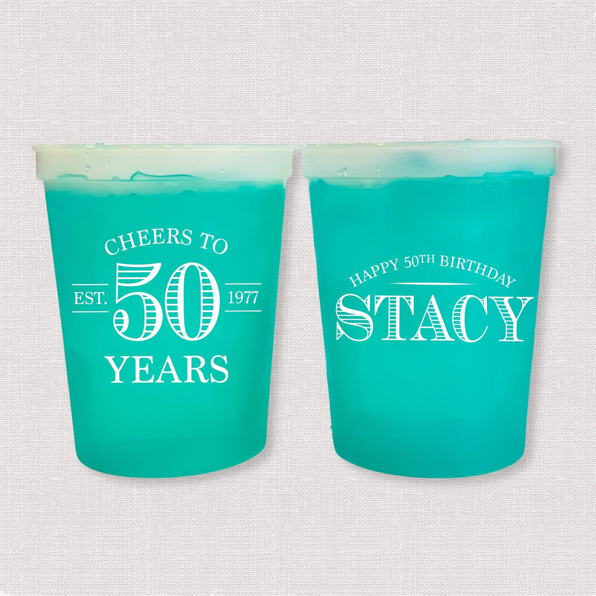 Teal color changing birthday stadium cups with vintage Cheers to 50 Years design and Happy 50th Birthday name