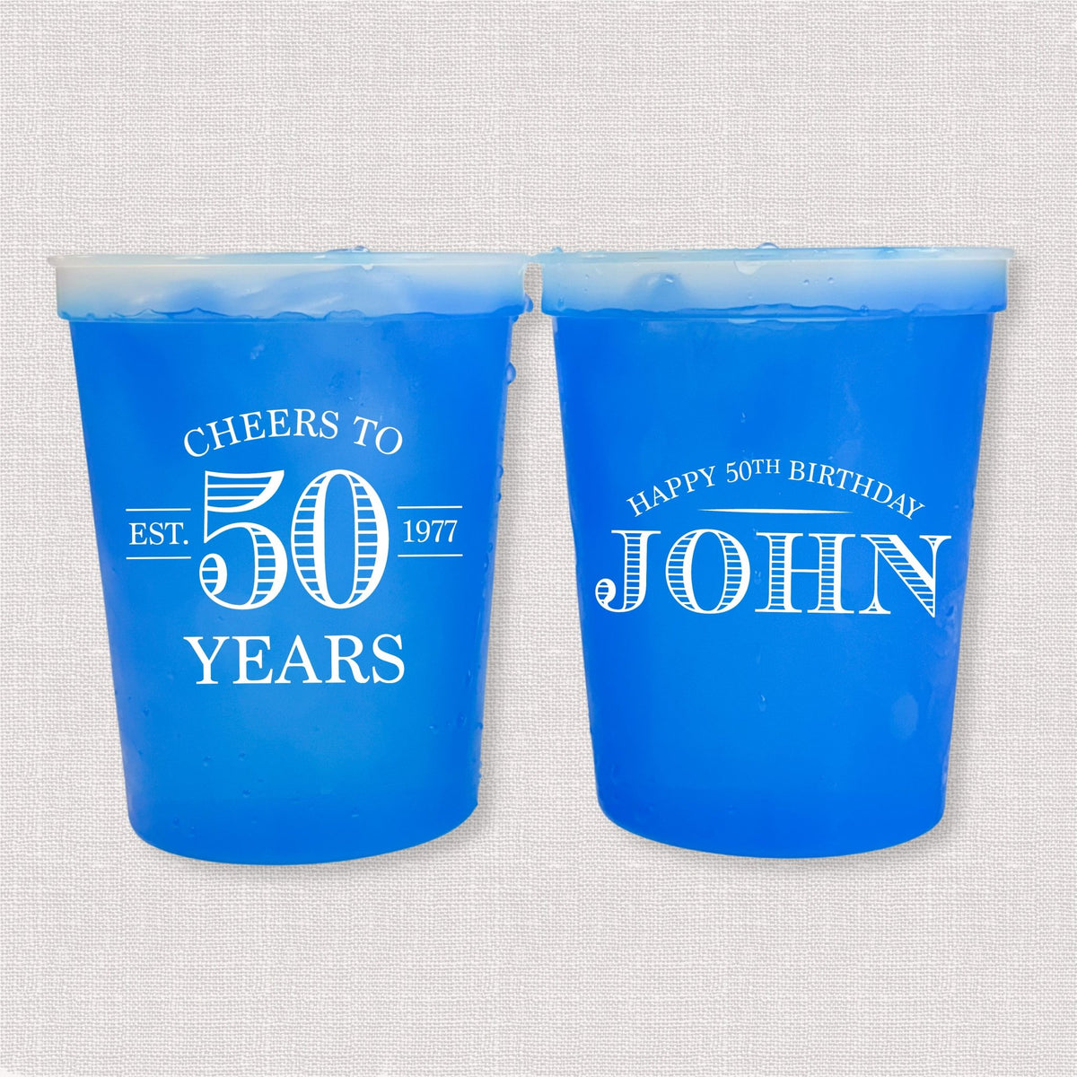 Blue color changing birthday stadium cups with vintage Cheers to 50 Years design and Happy 50th Birthday name