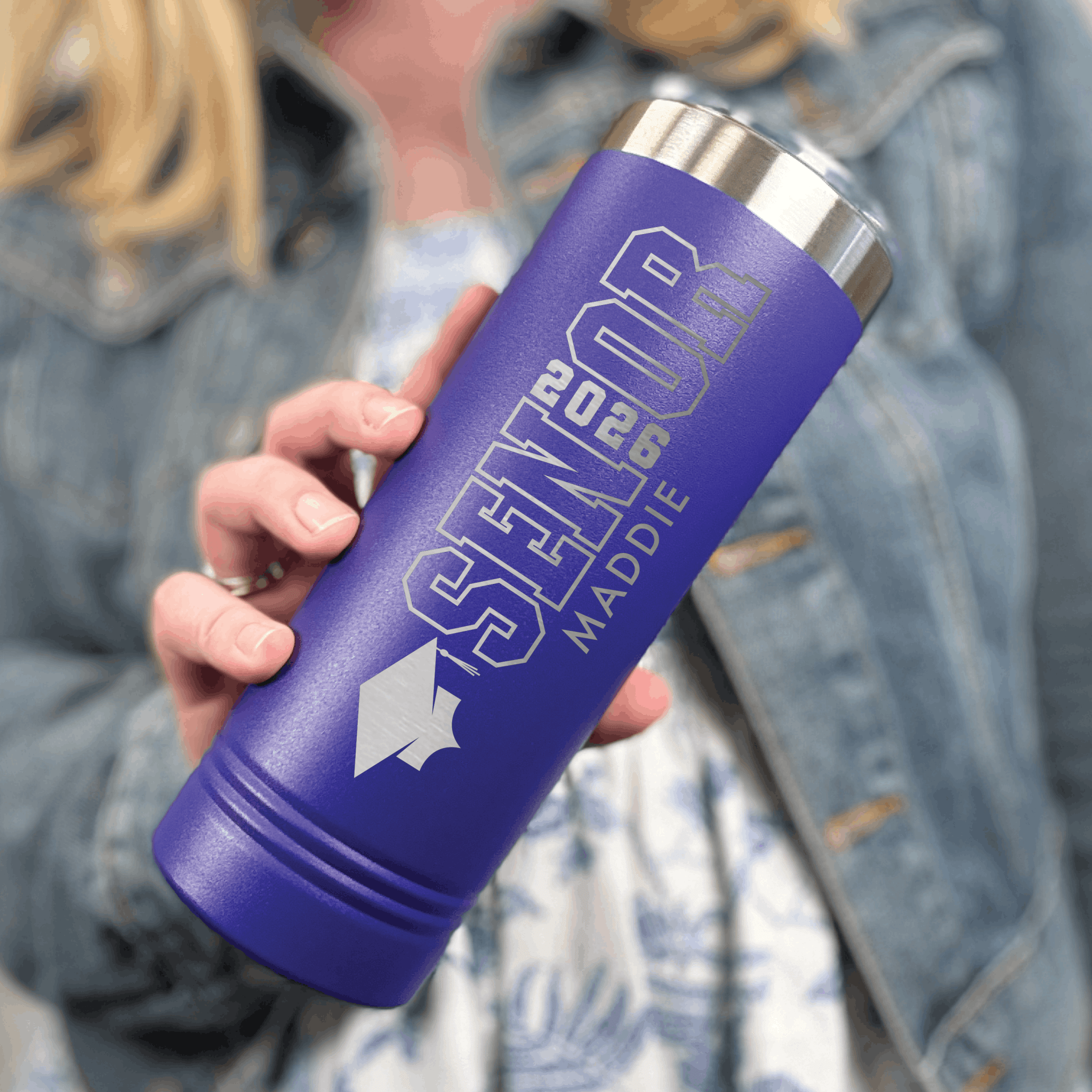 Purple insulated tumbler with silver class year and personalized senior text design