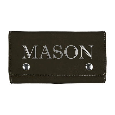 A personalized dark brown faux leather key holder featuring contrasting white stitching and two silver snap closures, ideal for organizing keys or small essentials.